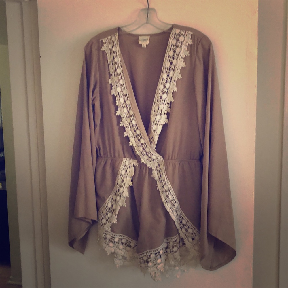 Tan romper with white lace trim